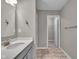 Bathroom featuring a gray vanity, and tile flooring, and a doorway leading into an adjacent room at 15359 Manning Way, Westfield, IN 46074