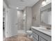 Bathroom showcasing a glass shower, gray vanity, toilet, and neutral tones for a clean, modern aesthetic at 15359 Manning Way, Westfield, IN 46074