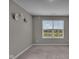 Bedroom featuring plush carpeting, a large window letting in natural light, and neutral-toned walls at 15359 Manning Way, Westfield, IN 46074