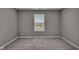 Comfortable bedroom featuring plush carpeting and a window view of the neighborhood at 15359 Manning Way, Westfield, IN 46074