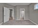 Spacious bedroom featuring neutral walls, carpet flooring, and doorways to a bathroom and walk-in closet at 15359 Manning Way, Westfield, IN 46074