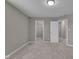 Bedroom with neutral carpet, neutral walls, a closet, and multiple doorways showcasing a versatile living space at 15359 Manning Way, Westfield, IN 46074