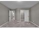 Well-lit bedroom with plush carpeting, closet, and doorway to a bathroom at 15359 Manning Way, Westfield, IN 46074