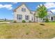 Charming two-story home featuring a combination of brick and stone facade with a well-maintained front yard at 15359 Manning Way, Westfield, IN 46074