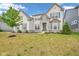 Charming two-story home featuring a combination of brick and stone facade with a well-maintained front yard at 15359 Manning Way, Westfield, IN 46074