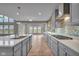 Modern kitchen featuring a spacious island, stainless steel appliances, and a decorative backsplash at 15359 Manning Way, Westfield, IN 46074