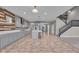 Spacious kitchen boasts an island, staircase, and stainless steel appliances at 15359 Manning Way, Westfield, IN 46074