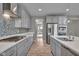 Modern kitchen boasting stainless steel appliances and sleek gray cabinetry at 15359 Manning Way, Westfield, IN 46074