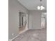 Open-concept living room with neutral walls, carpet flooring, and doorway views of the home's staircase at 15359 Manning Way, Westfield, IN 46074