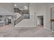 Open living room with dark-stained staircase at 15359 Manning Way, Westfield, IN 46074
