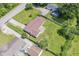 Aerial view of the house with a large backyard, driveway, and surrounding neighborhood at 1543 W 79Th St, Indianapolis, IN 46260