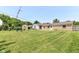 Large backyard with a well-maintained lawn, shed, and access to the home at 1543 W 79Th St, Indianapolis, IN 46260