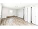 Bedroom with hardwood floors and window with blinds with a sliding door closet at 1543 W 79Th St, Indianapolis, IN 46260