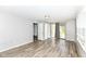 Bright bedroom with hard wood floors, a window with blinds and a door to the backyard at 1543 W 79Th St, Indianapolis, IN 46260