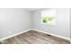 Bright bedroom with hardwood floors and window with blinds at 1543 W 79Th St, Indianapolis, IN 46260