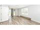 Bedroom with hard wood floors, blinds in the window and a door to the backyard at 1543 W 79Th St, Indianapolis, IN 46260