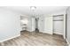 Spacious bedroom featuring wood laminate flooring, a vanity and a closet at 1543 W 79Th St, Indianapolis, IN 46260