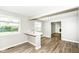 Cozy living room offers natural light and direct access to the fireplace and entry to kitchen at 1543 W 79Th St, Indianapolis, IN 46260