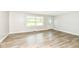 Comfortable living room with bright windows, contemporary flooring, and a front entry with a detailed door at 1543 W 79Th St, Indianapolis, IN 46260