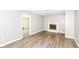 Bright living room featuring wood laminate flooring and a decorative fireplace at 1543 W 79Th St, Indianapolis, IN 46260