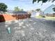 Wide gravel backyard featuring a detached garage and wooden fence at 1628 Spann Ave, Indianapolis, IN 46203