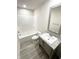 Bathroom featuring a vanity with gray cabinets and a granite countertop and a tub/shower combo at 1628 Spann Ave, Indianapolis, IN 46203