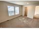 Bright bedroom featuring neutral carpet and two windows offering natural light at 1628 Spann Ave, Indianapolis, IN 46203