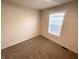Simple bedroom featuring a window and neutral carpet at 1628 Spann Ave, Indianapolis, IN 46203