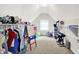 Bright attic with shelving and a carpeted floor provides ample storage and flexible space at 1808 Woodfield Dr, Greenwood, IN 46143
