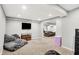 Cozy finished basement with a flat-screen television, comfortable seating, and recessed lighting at 1808 Woodfield Dr, Greenwood, IN 46143