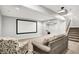 Finished basement features a large projection screen, comfortable seating, and recessed lighting at 1808 Woodfield Dr, Greenwood, IN 46143