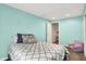 This bedroom boasts blue walls, a cozy carpet, a small chair and built in lighting at 1808 Woodfield Dr, Greenwood, IN 46143
