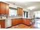 This spacious kitchen has stainless steel appliances, mosaic tile backsplash, and cherry cabinets at 1808 Woodfield Dr, Greenwood, IN 46143