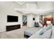 Open-concept living room has a large television and seamless access to other living spaces at 1808 Woodfield Dr, Greenwood, IN 46143