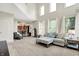 Open-concept living room features a comfortable sofa, a fireplace, and seamless access to other living spaces at 1808 Woodfield Dr, Greenwood, IN 46143