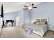 Large main bedroom with vaulted ceiling, carpet, ceiling fan and desk at 1808 Woodfield Dr, Greenwood, IN 46143