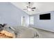 Large main bedroom with vaulted ceiling, carpet, ceiling fan and ensuite access at 1808 Woodfield Dr, Greenwood, IN 46143