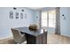 Comfortable home office with a modern desk, chair, and a large window for natural light at 1808 Woodfield Dr, Greenwood, IN 46143