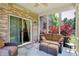 Screened porch featuring a comfortable sofa and cushioned chairs, creating an inviting outdoor space at 1808 Woodfield Dr, Greenwood, IN 46143