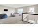 Comfortable upstairs sitting room with sofa, beanbag chair, and window at 1808 Woodfield Dr, Greenwood, IN 46143