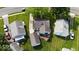Aerial shot of the home with a deck, showing its location among neighboring houses and green yards at 1837 Bauer Rd, Indianapolis, IN 46218