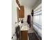 Cozy bathroom featuring a shower with blue striped curtain, mirrored medicine cabinet, and tile accents at 1837 Bauer Rd, Indianapolis, IN 46218