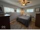 Comfortable bedroom with natural light, ceiling fan, and stylish decor for a peaceful retreat at 1837 Bauer Rd, Indianapolis, IN 46218