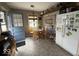 Eat-in kitchen featuring wood chairs, wall decor, and natural light from window at 1837 Bauer Rd, Indianapolis, IN 46218