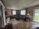 Inviting living room features hardwood floors, two gray sofas, and natural light from the window at 1837 Bauer Rd, Indianapolis, IN 46218
