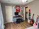 Versatile room with a desk, guitars, and ample space for hobbies or work at 1837 Bauer Rd, Indianapolis, IN 46218