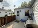 Shows an exterior doorway to the side of the house with a fenced in patio at 1837 Bauer Rd, Indianapolis, IN 46218