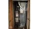 View of American Standard furnace and water heater in a closet with louvered doors at 1837 Bauer Rd, Indianapolis, IN 46218