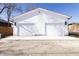 New construction duplex with a two-car garage and matching addresses on each side at 2051-2053 Columbia Ave, Indianapolis, IN 46202