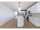 Bright kitchen features a central island, stainless steel appliances, and modern lighting at 2051-2053 Columbia Ave, Indianapolis, IN 46202